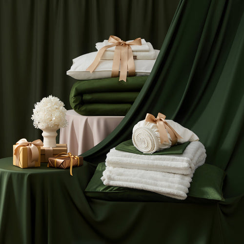 Organic Cotton Modern Cozy Bundle: white sheets, rifle green duvet cover, off-white blankets, gift boxes.