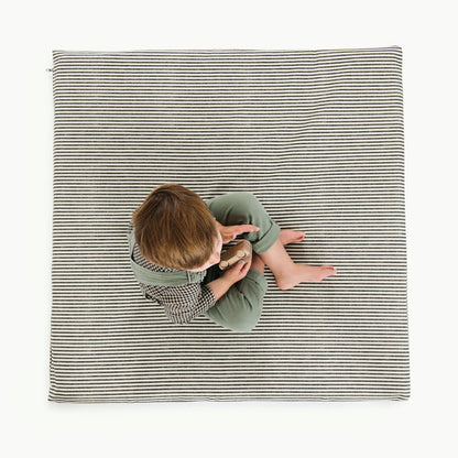 Stone Stripe / Square@Overhead of boy sitting on Stone Stripe Padded Mini Square