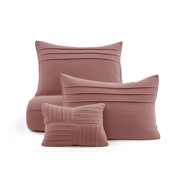 Rose pink GentleSoft pinch pleat comforter set with pillowcase and decorative pillow on white background.