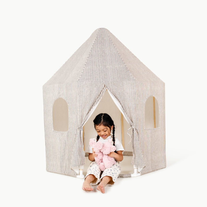 Stone Stripe@little girl sitting in the play tent