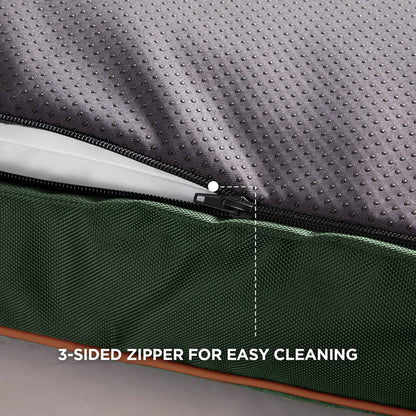 Plush waterproof dog bed with zipper partially open showing white filling, ideal for easy cleaning.