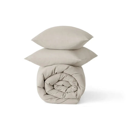 GentleSoft® prewashed cotton comforter set in beige, rolled comforter and two shams with natural wrinkles.