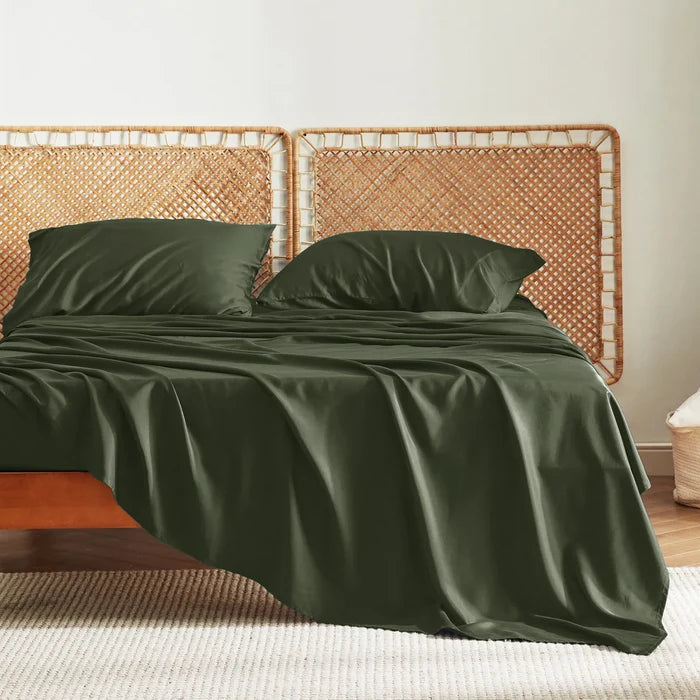 Dark green rayon derived from bamboo bedding set featuring silky soft texture and woven rattan headboard.