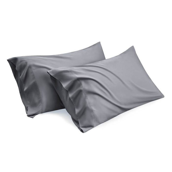Two charcoal grey bamboo rayon pillowcases, smooth texture, elegant drape. Product view.