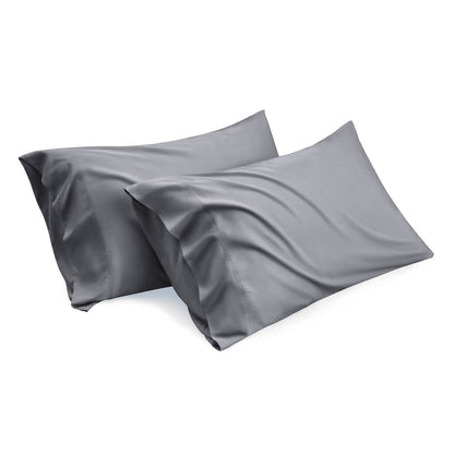Two charcoal grey bamboo rayon pillowcases, smooth texture, elegant drape. Product view.