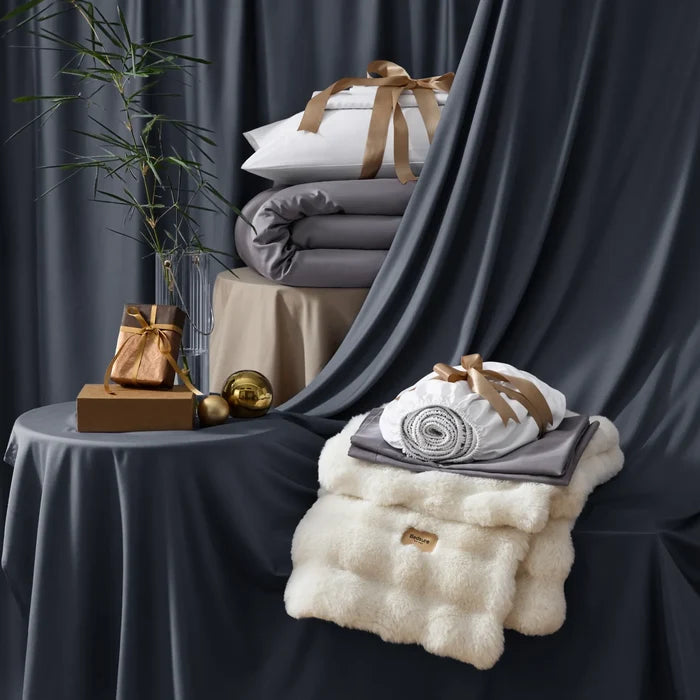 Stacked rayon derived from bamboo luxe bundle: duvet, sheets, and plush blanket.