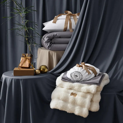 Stacked rayon derived from bamboo luxe bundle: duvet, sheets, and plush blanket.