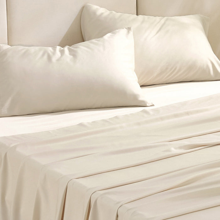 Rayon derived from bamboo bedding bundle in cream, soft texture.