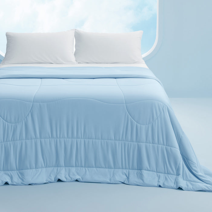 Light blue reversible cooling comforter featuring silky soft texture and a quilted pattern.