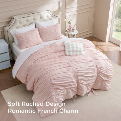 Pink ruched comforter set with bows, soft romantic French charm.