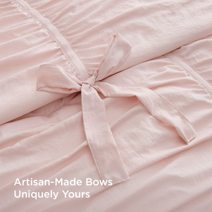 Pink ruched comforter set with handcrafted artisan bows.