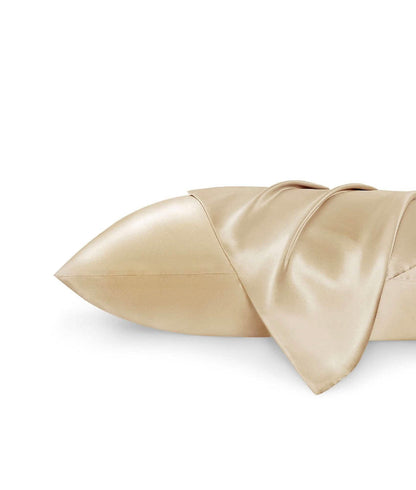 GentleSoft satin body pillowcase in light gold, showcasing smooth texture and soft drape on white background.