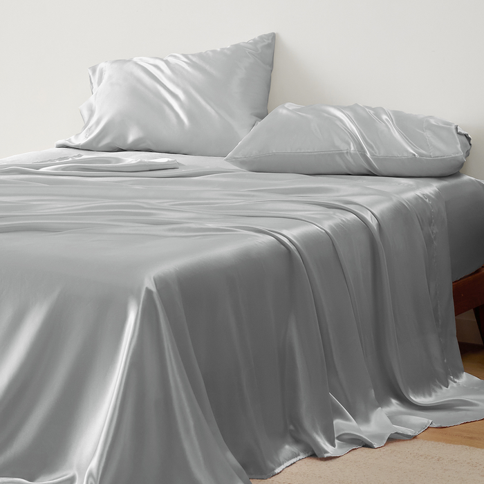 GentleSoft cool silver satin sheet set on bed, highlighting smooth, lustrous texture and soft feel for luxurious comfort.
