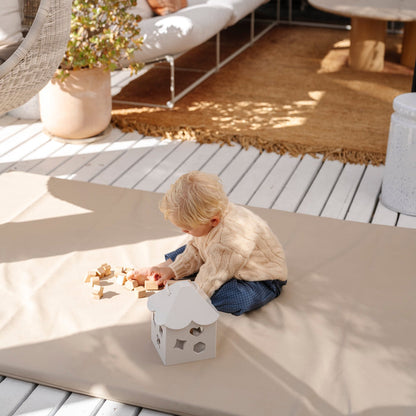 Ivory@Baby using a shape sorter to practice fine motor skills