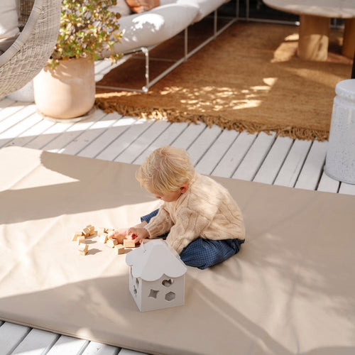 Ivory@Baby using a shape sorter to practice fine motor skills