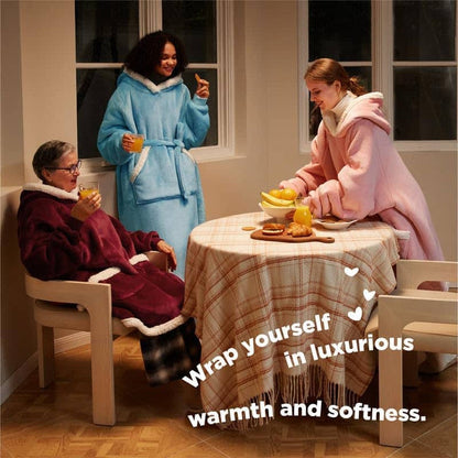 People in maroon, blue, pink sherpa blanket hoodies enjoying cozy indoor moment. Features adjustable belt & deep pockets.