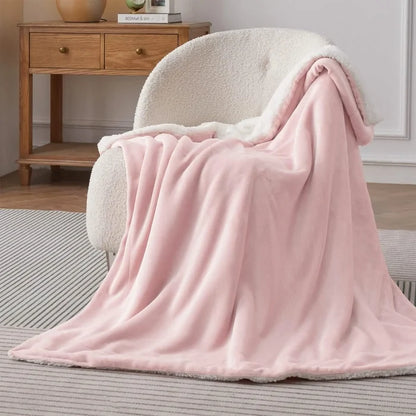 Pink GentleSoft Sherpa Fleece Blanket draped over armchair, showcasing dual-sided plush and velvety textures.