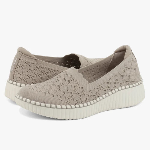 Taupe Skechers Women's Wilshire Blvd knitted slip-on shoes with white ridged wedge soles, shown from a low angle.