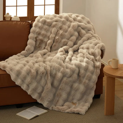 Bedsure luxe plush blanket with ripple texture in warm beige, on sofa.