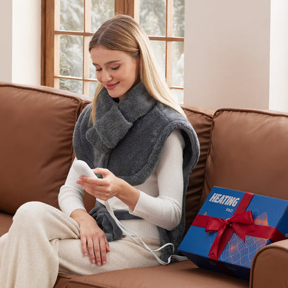 Cozy grey faux cashmere Smart Heating Pad for neck & shoulders on snowy day.