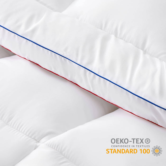 GentleSoft thick mattress topper close-up showing plush fill, box-stitch, red & blue piping, OEKO-TEX certified.