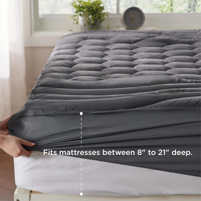 Three-zone quilted mattress pad in grey, showing deep-fit elastic skirt for mattresses 8-21".