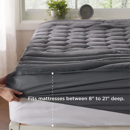 Three-zone quilted mattress pad in grey, showing deep-fit elastic skirt for mattresses 8-21".