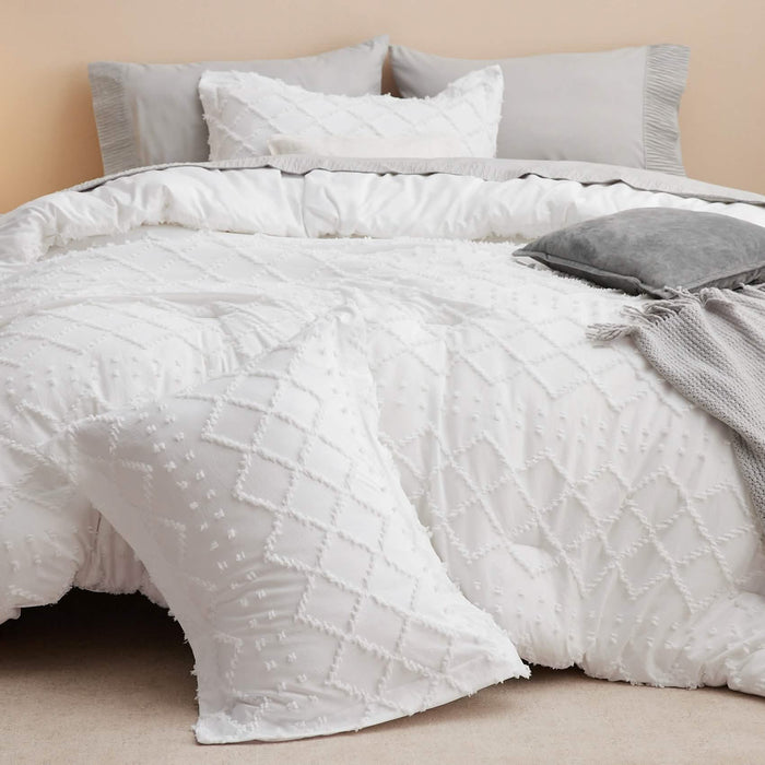 GentleSoft white comforter set with diamond tufted pattern and matching shams, styled on a bed on product page.