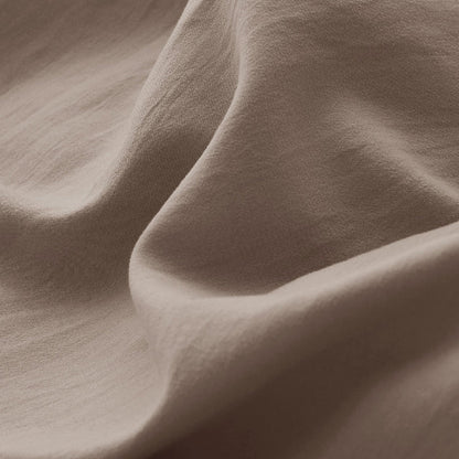 Close-up of taupe GentleSoft microfiber duvet cover fabric, highlighting its soft texture and natural drape.