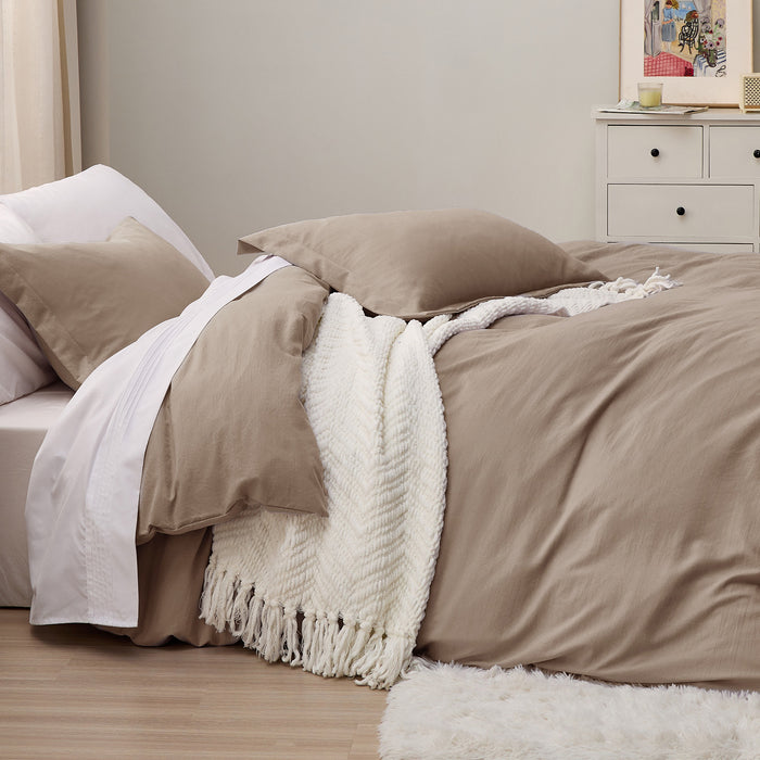 Taupe GentleSoft microfiber duvet cover set on bed with white throw blanket and pillows, showcasing soft texture.