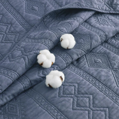 Blue diamond-quilted 100% cotton voile quilt set with decorative cotton bolls.