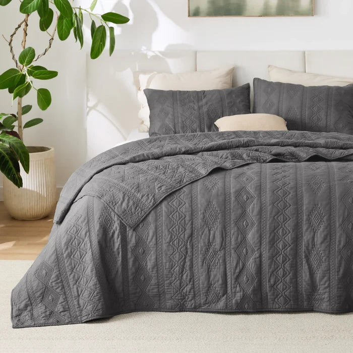Grey Voile Cotton Quilt Set featuring quilted geometric diamond and stripe patterns.