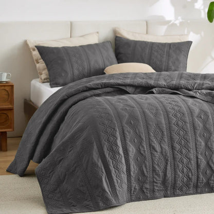 Dark grey cotton voile quilt set with diamond geometric pattern.