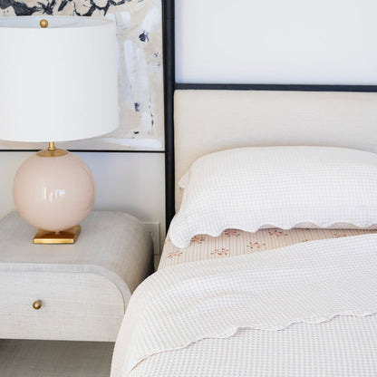 Ivory@Textured cotton waffle coverlet styled in a child’s bedroom