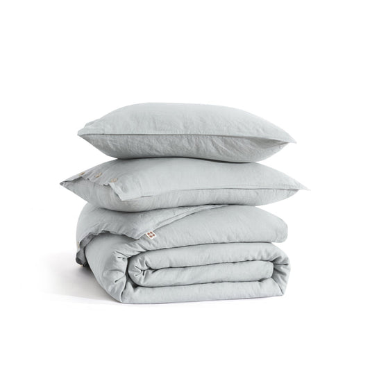 PureWoven washed linen duvet cover set and pillow shams in light grey with button closure.