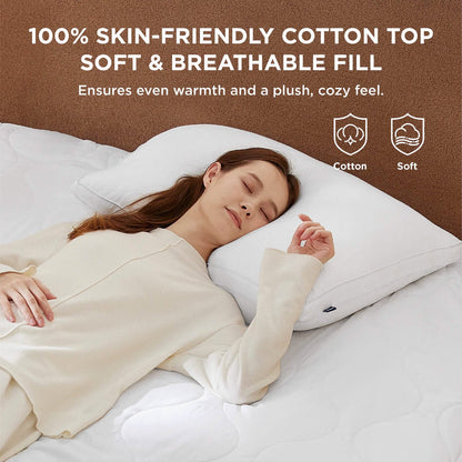 Woman sleeping on a soft, 100% cotton heated mattress pad with breathable fill for cozy comfort.