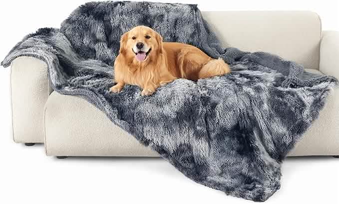 Waterproof tie-dye pet blanket with plush faux fur, Golden Retriever on sofa.