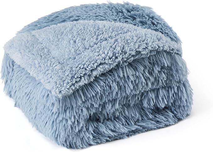 Plush light blue reversible waterproof pet blanket with shaggy faux fur and soft fleece textures, polyester material.