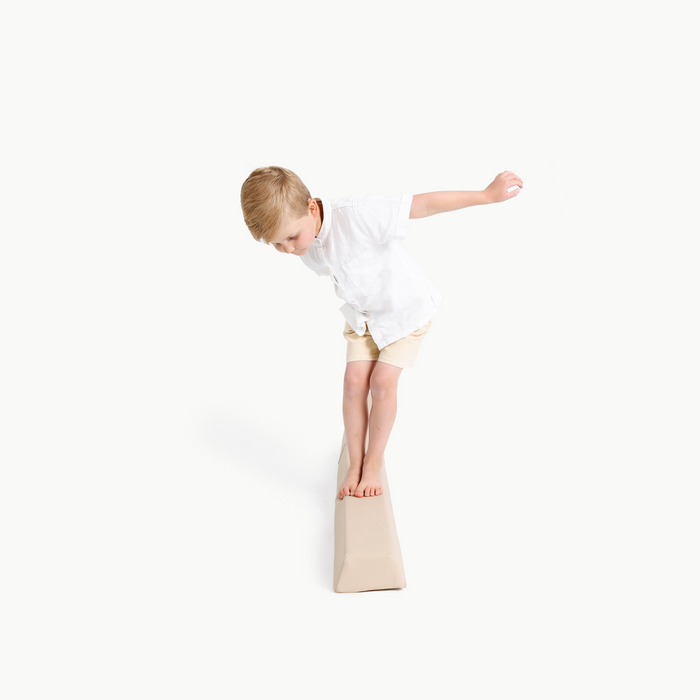 Millet@kid playing on the millet balance beam