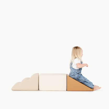 kid playing on the mini climber playset