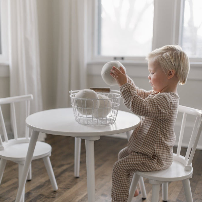 Ivory@Kid playing with the Ivory Play Ball Set on a table