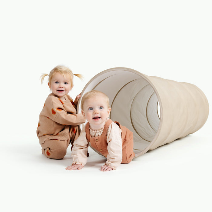 Millet@kids playing with the millet tunnel